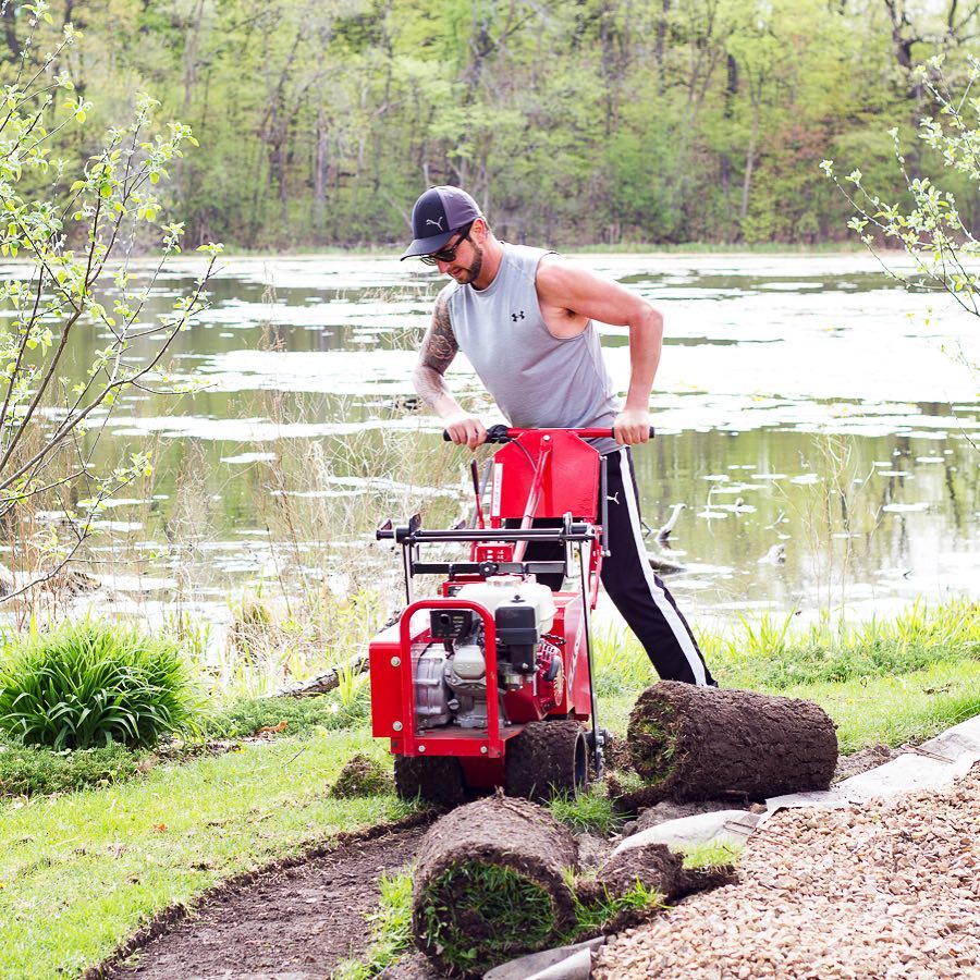 Adam working outdoors at home near the water